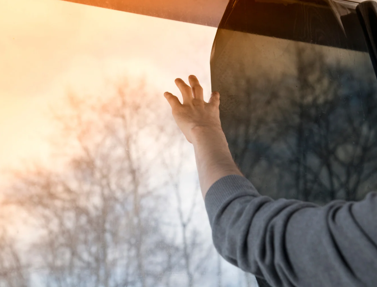 man put up safety window film installation
