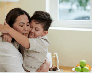 Asian mom hugs son knowing safety window protection GTA gives her peace of mind