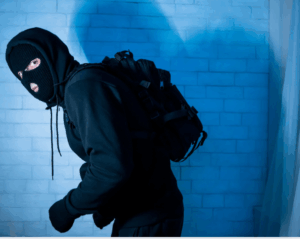burglar sneaking away because window safety film installation toronto